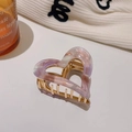 Detail of heart hair claw in pastel lavender and pink acrylic with gold metal clip - Pink