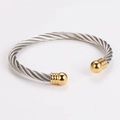 Two-tone cable twist bangle in stainless steel with golden sphere end caps - Gold & Silver (65mm)