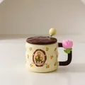 Cream ceramic tulip mug with brown handle, wavy lid and yellow ball stirring spoon - With Lid and Spoon / Brown