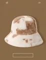 Thick plush bear ear bucket hat featuring a vintage brown and white cow pattern finish - Cow Print Bucket Hat - Khaki