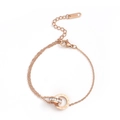 Macro detail of rose gold interlocked double rings with Roman numerals and crystals - Anklet / Rose Gold