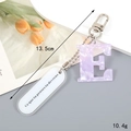 Detail of purple marble letter E keychain with silver hardware and measurements - Letter E