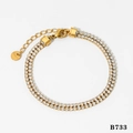 Bracelet double rangée en zircons et acier inoxydable plaqué or avec fermoir mousqueton - Bracelet / Bracelet Doré (B733)