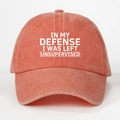 Detail showing coral orange washed cotton baseball cap with white printed text - Orange