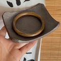 Handcrafted round wooden bangle featuring natural textures and a vintage ethnic style aesthetic - Brown