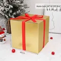Large 40cm matte gold Christmas gift box with red ribbon for holiday window display - 40cm Matte Gold Gift Box