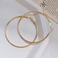 Polished gold large hoop earrings in a minimalist style for a sophisticated daily look - 6cm / Gold