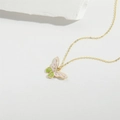 Exquisite gold butterfly pendant necklace with pink and green enamel on stone background - Pink Butterfly