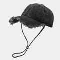 Detail of frayed edges on vintage denim baseball cap with adjustable windproof cord - Black