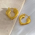 Detailed macro view of 18K gold plated heart stud earrings on stone and fabric - Gold 103/Heart