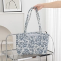 Close-up of floral quilted tote bag featuring embroidery and spacious cotton design - Dark Blue Floral