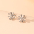 Detail of silver flower stud earrings with minimalist design on soft warm background - Silver Daisy Stud Earrings (H117)