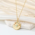Gold evil eye coin necklace with colorful zircon stones on white silk background - Colorful Zirconia Round Eye