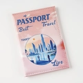 Close-up of a pink PU leather passport cover with Dubai skyline UV print and stitching - Pink