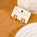 Polished gold letter D stud earrings in balloon style on a white display card - Letter D