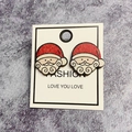 Festive Santa Claus wooden stud earrings in red and white on a stylish white jewelry card - Santa Claus