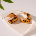 Detailed close-up of C-shaped gold-plated earrings with vintage leopard print patterns - Silver Needle Leopard C-Shape Geometric Earrings