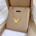 Golden titanium steel necklace featuring a frosted butterfly pendant on a silk background - Matte Butterfly Pendant Gold (N119)