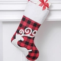 Classic red and black buffalo plaid Christmas stocking with white faux fur trim hanging - Elk Style