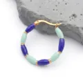 Detail of gold bamboo-style earrings with blue and mint green enamel beads on a grey rock - Bamboo Joint Style (T1278) / 1 Piece (31x31mm) / Dark Blue