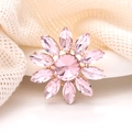 Pink crystal flower brooch with gold plating on soft knit fabric, elegant jewelry accessory - Pink