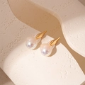 Artistic baroque pearl earrings with gold tapered studs on a minimalist stone texture - Gold Irregular Pearl (Silver Needle)