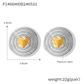 Macro view of titanium steel wavy hoop earrings with gold heart detail and 3cm size specs - Two-tone Ripple Heart