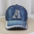 Détail d'une casquette en jean bleu avec strass argentés sur la visière et la lettre A - No.28-Lettre A Strass-Bleu