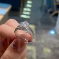 Macro shot of a silver wedding ring with round-cut moissanite and double pavé band - TJZ401-Luxury Double Row Pave