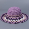 Close-up of bohemian purple hand-crocheted straw hat with floral knit wide brim detail - M(56-58cm) / Purple