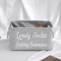 Grey canvas storage basket with cotton rope handles and Lonely Socks Seeking Solemates print - 35x24x20cm