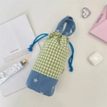 Close-up of drawstring water bottle bag with green plaid and blue star patterns - Green Check