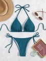 Two-piece teal triangle bikini set with side-tie bottoms on white marble surface - Peacock Blue (Bikini Set)
