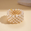Detailed close-up of multi-layer baroque pearl bracelet with gold plated diamond spacers - Gold
