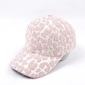 Detail of plush faux fur baseball cap featuring pink and white leopard print pattern - Pink Leopard