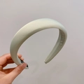 Padded wide light green satin headband with a sponge core and smooth fabric finish - White
