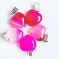 15mm natural pink quartz heart pendants with silver bails on a white background - Rose Red Agate
