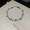 Macro shot of sparkling silver flower bracelet with blue zircon waterdrop crystals - Silver (Sky Blue)