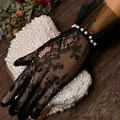 Elegant black lace fingerless gloves featuring delicate floral patterns and pearl trim - Lace Pearl Black