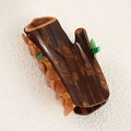 Creative tree trunk hair claw clip with brown wood texture and green leaf details - Tree Stump