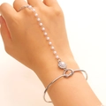Detail of silver slave bracelet with delicate white pearls and floral charm pendant - Silver Floral Pearl Style (M-002)