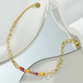 Detalle de cadena de acero inoxidable de 14k con cuentas de colores y placa S.Steel - Cuentas de colores