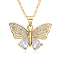 Detailed close-up of a gold-plated butterfly pendant set with sparkling zircon stones - F237