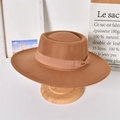Detail view of a brown wool felt fedora with ribbon trim on a wooden display stand - Adult / Coffee (Bowknot)