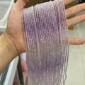 Faceted light purple amethyst beads strand held in hand showing natural stone texture - Gradient Lavender 3mm