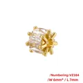 Makroaufnahme einer 18K vergoldeten 6x7mm Zylinderperle mit Baguette-Zirkonia - VZ384-6*7mm / Gold
