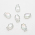 Macro view of six transparent iridescent fish-shaped crystal glass beads for DIY jewelry - AB White