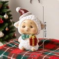 Miniature Christmas resin sheep figurine measuring 5.4cm high on a festive plaid surface - Lamb