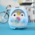 Detail macro view of a cute blue plush penguin keychain holding a small popsicle ornament - 10cm (Bead Chain) / Blue