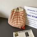 Striped knit pleated bucket bag in beige and orange with bow drawstring detail - Beige Red Striped